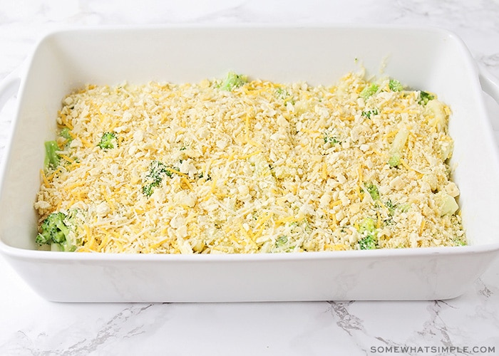 a casserole with broccoli and a crushed cracker topping