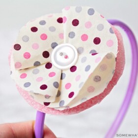 a large fabric flower on a headband