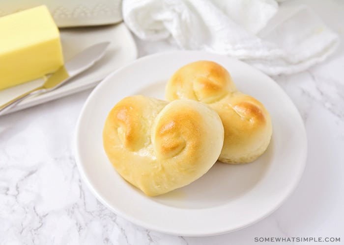 two heart shaped dinner rolls on a plate