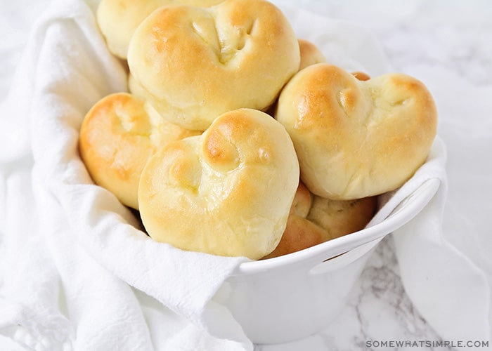 heart shaped dinner rolls in a basket