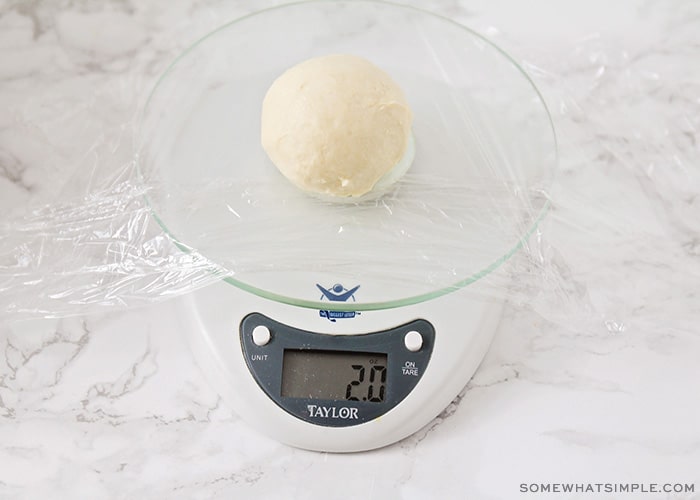 a ball of dough on a scale
