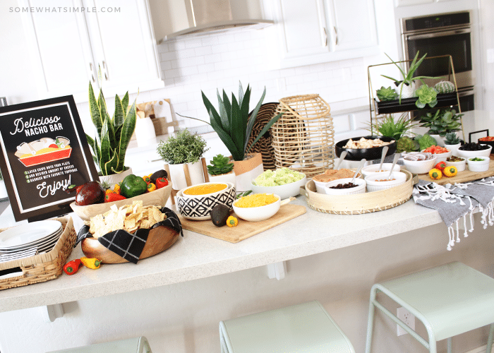 a nacho bar with several toppings