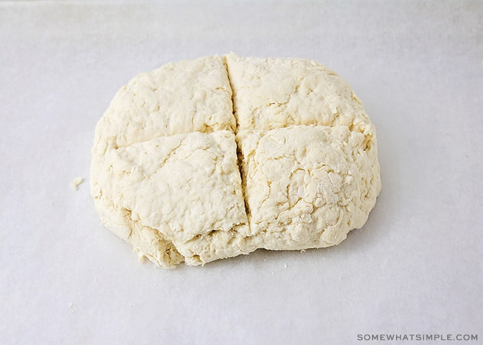 bread dough with a cross cut into it