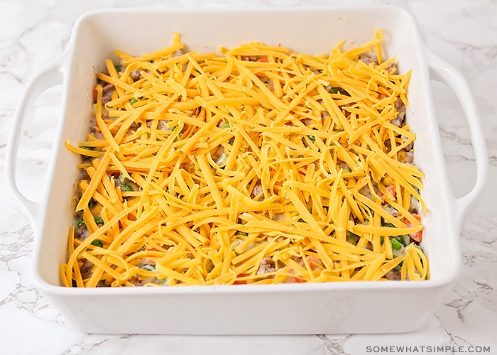 a casserole topped with shredded cheese