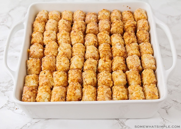 a casserole topped with rows of tater tots