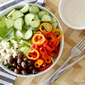 colorful garden salad with creamy italian dressing