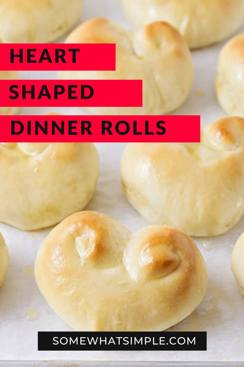 These heart shaped dinner rolls are a fun addition to any romantic homemade dinner.  In just a few simple steps you can transform what would be ordinary bread into a heart shaped masterpiece.  Whether it's Valentine's Day your anniversary or any other special occasion, this bread is perfect for that special dinner. via @somewhatsimple