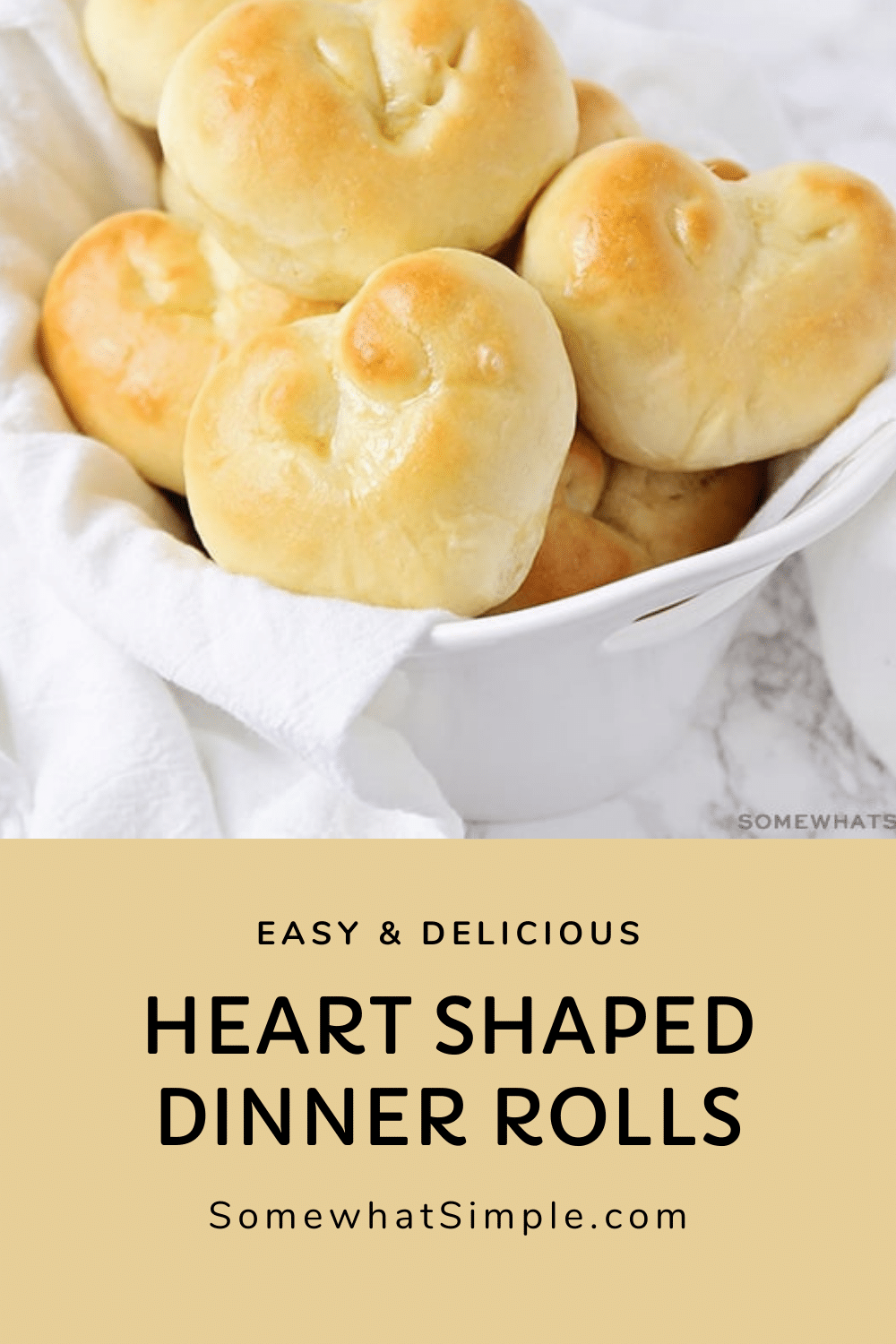 These heart shaped dinner rolls are a fun addition to any romantic homemade dinner.  In just a few simple steps you can transform what would be ordinary bread into a heart shaped masterpiece.  Whether it's Valentine's Day your anniversary or any other special occasion, this bread is perfect for that special dinner. via @somewhatsimple