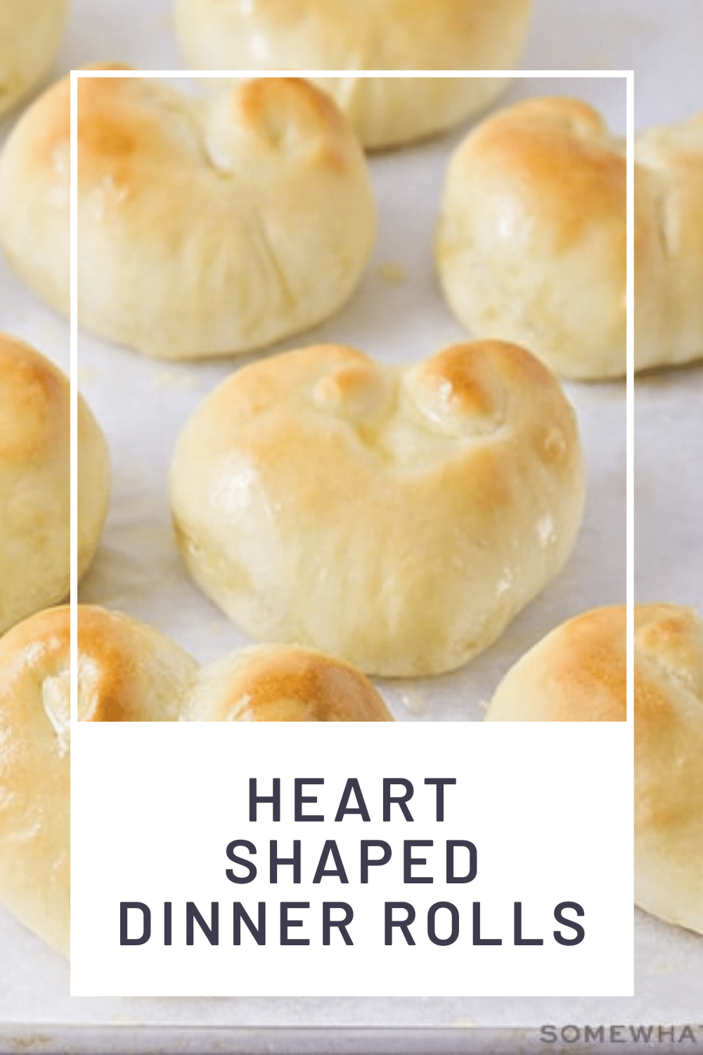 These heart shaped dinner rolls are a fun addition to any romantic homemade dinner.  In just a few simple steps you can transform what would be ordinary bread into a heart shaped masterpiece.  Whether it's Valentine's Day your anniversary or any other special occasion, this bread is perfect for that special dinner. via @somewhatsimple