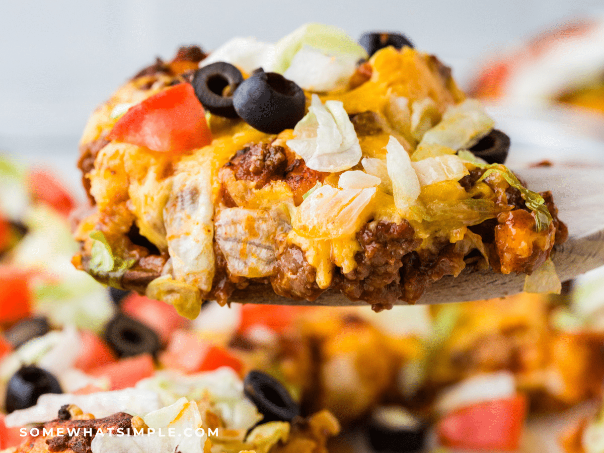 close up of a serving spoon holding Mexican Bubble Pizza