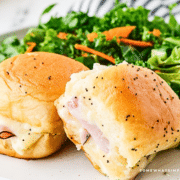 Ham and Cheese Sliders, plated next to a garden salad
