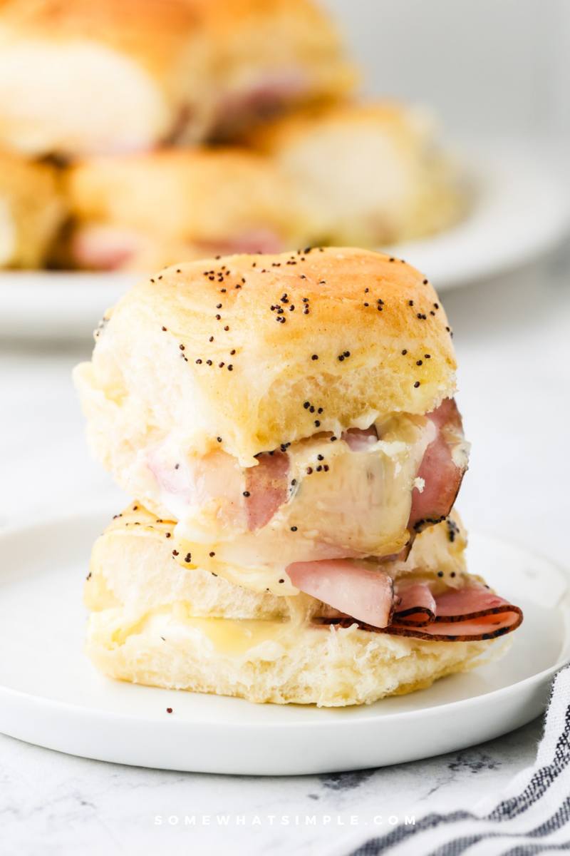 Ham and Cheese Sliders stacked on a plate