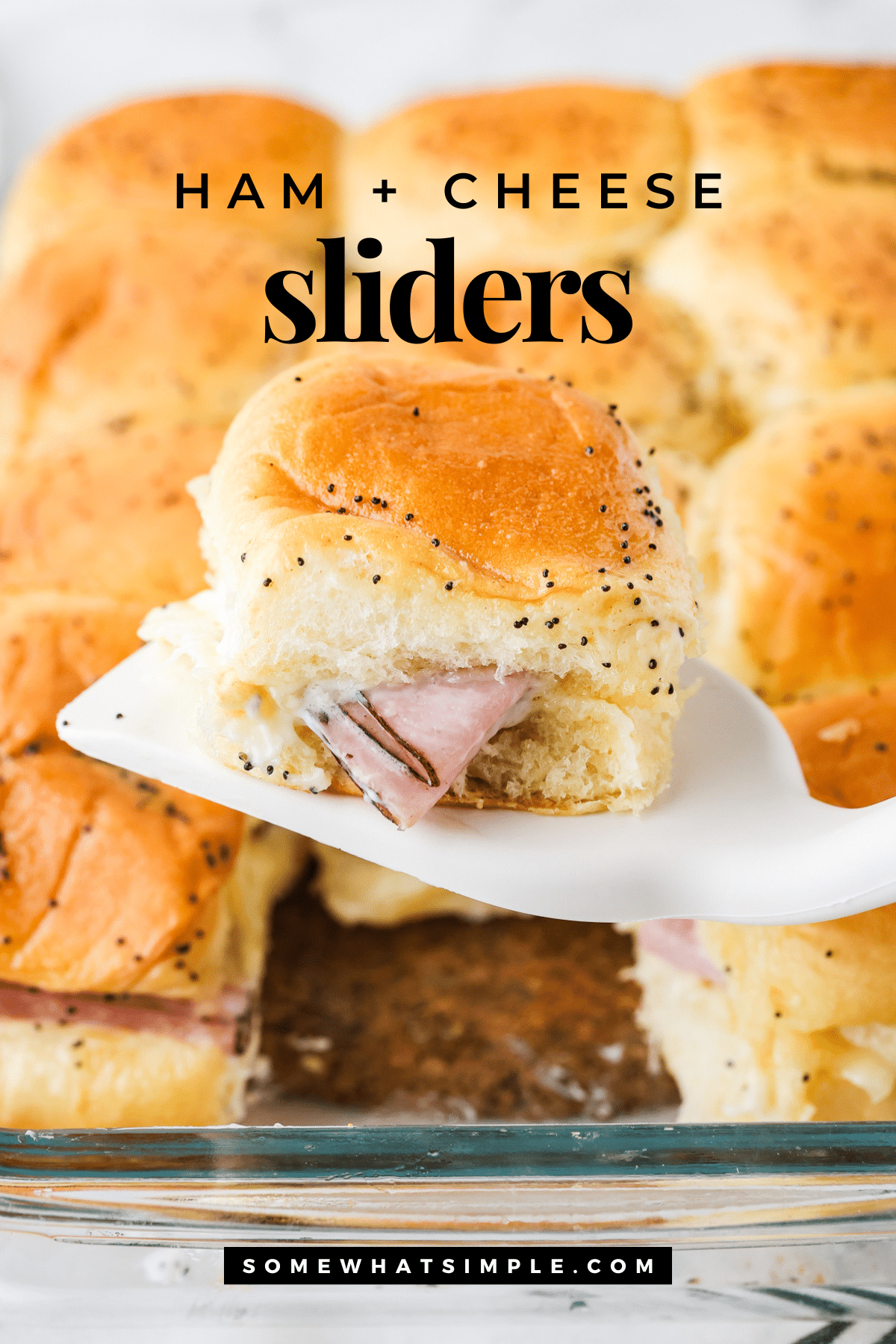 Juicy ham and Swiss cheese inside soft Hawaiian rolls brushed with a buttery topping that's baked is absolutely delicious! These Ham and Cheese Sliders are perfect as a simple dinner or feeding a crowd and could not be any easier to make! #hamsliders #hamandswisssliders #howtomakehamandcheesesliders #hamandcheesesliderrecipe #hawaiianrollhamsliders via @somewhatsimple