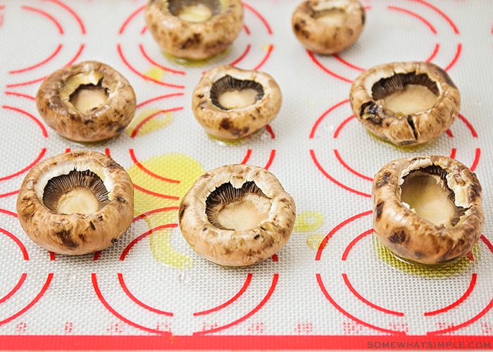 portobello mushroom caps on a baking sheet