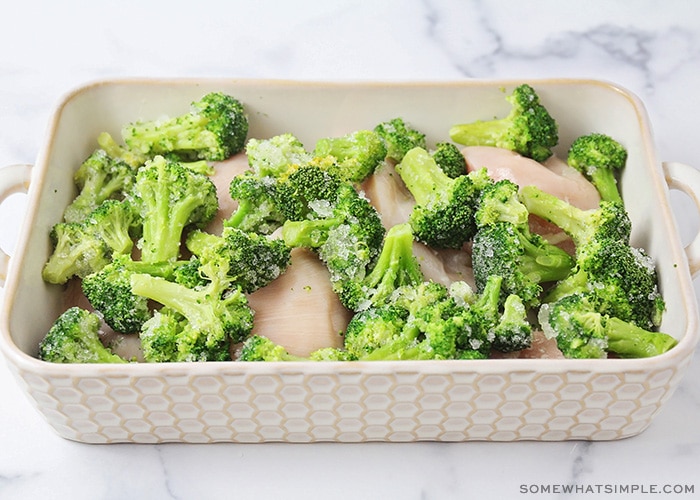 a baking dish with chicken and broccoli