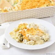 A plate full of chicken divan with a casserole dish full of this easy recipe in the background