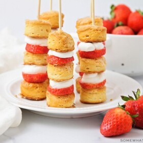 a plate of strawberry shortcake kabobs