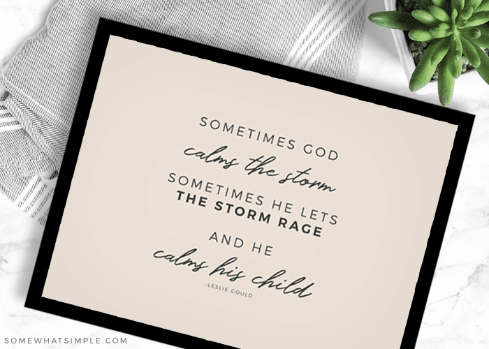 quote about god calming the storm in a black frame