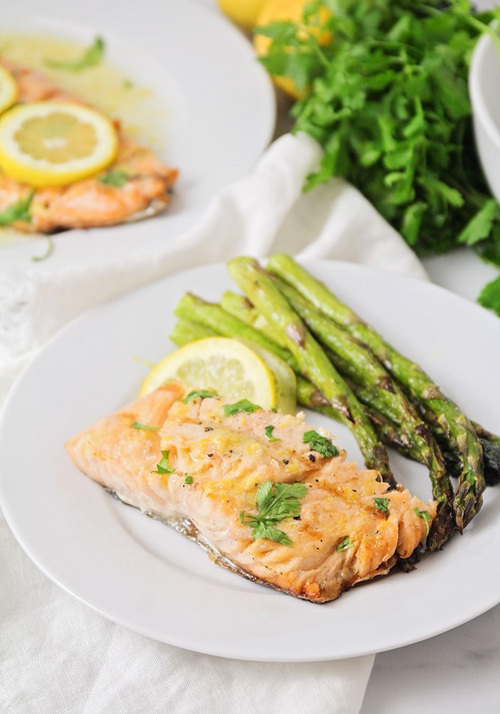 grilled salmon and asparagus on a white plate