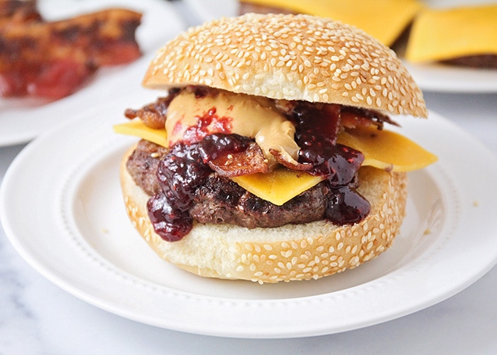 These peanut butter and jelly bacon cheeseburgers are over-the-top delicious, and so easy to make! They're a fun twist on a basic burger! 