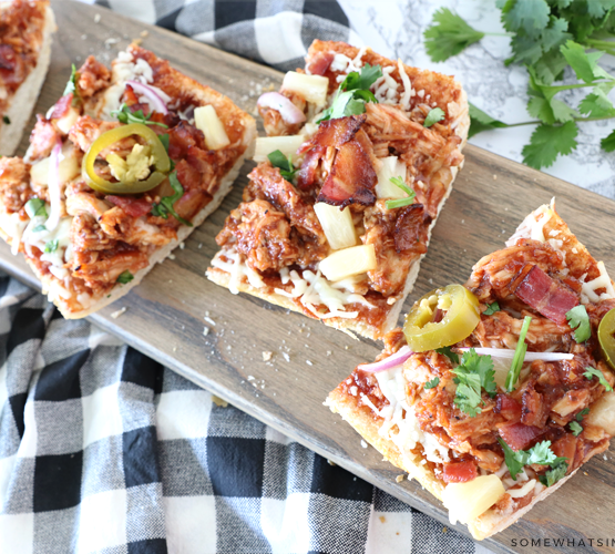 sliced french bread pizza on a cutting board