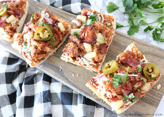 sliced french bread pizza on a cutting board