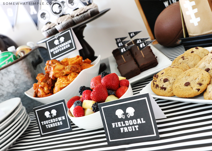 tailgating food on a table with food labels