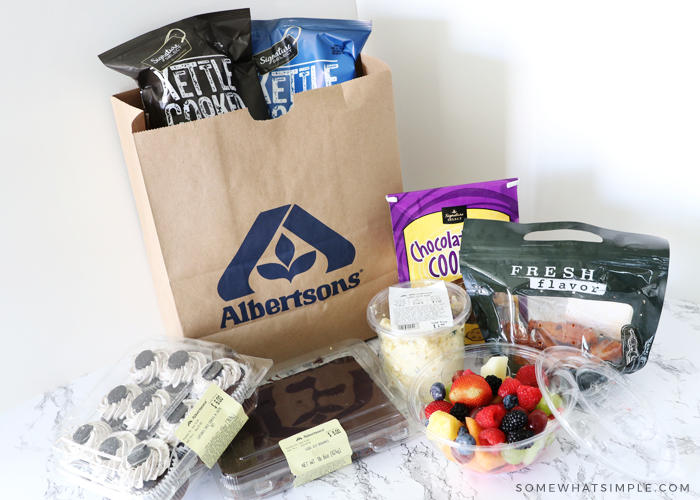 food for a tailgating party in an albertsons grocery bag