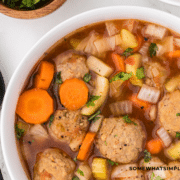 White bowl of Albondigas soup