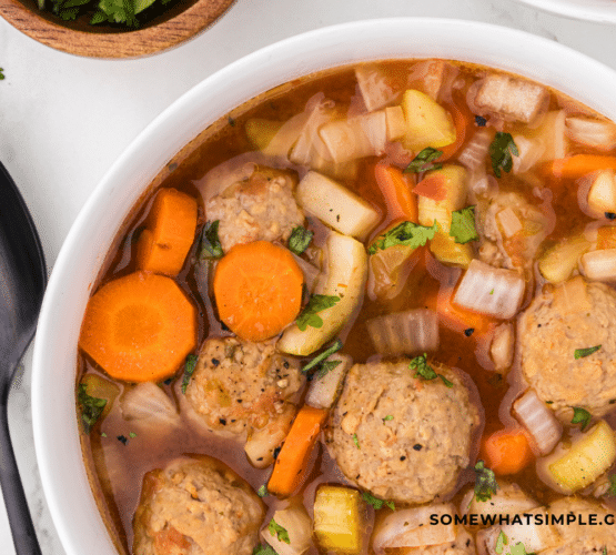 White bowl of Albondigas soup