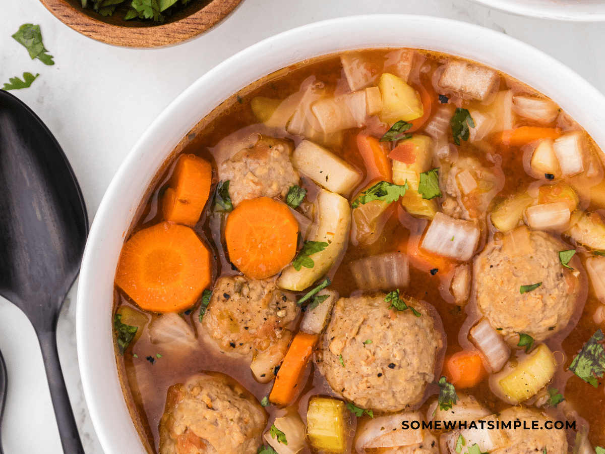 White bowl of Albondigas soup