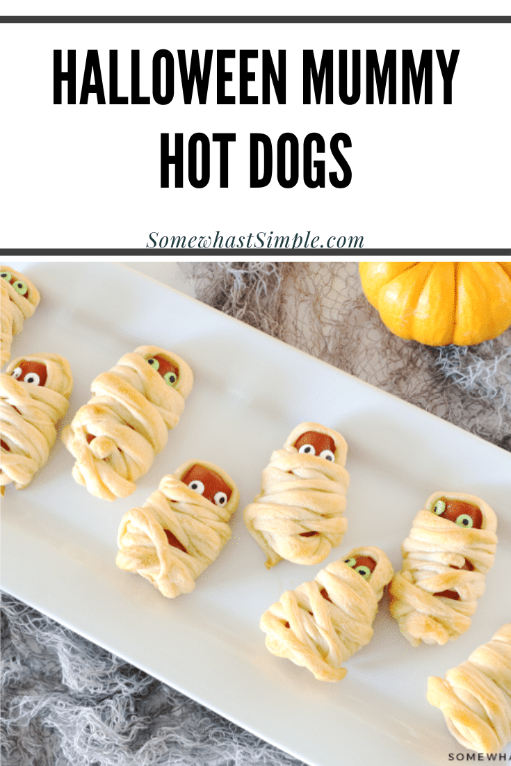 Mummy Hot Dogs are a hit with kids and Halloween party guests! They're a festive Halloween treat that's simple to make and delicious too! They're super easy to make by wrapping hot dogs in some crescent roll dough. They make the perfect Halloween snack or lunch recipe. via @somewhatsimple