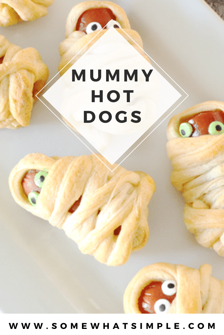 Mummy Hot Dogs are a hit with kids and Halloween party guests! They're a festive Halloween treat that's simple to make and delicious too! They're super easy to make by wrapping hot dogs in some crescent roll dough. They make the perfect Halloween snack or lunch recipe. via @somewhatsimple
