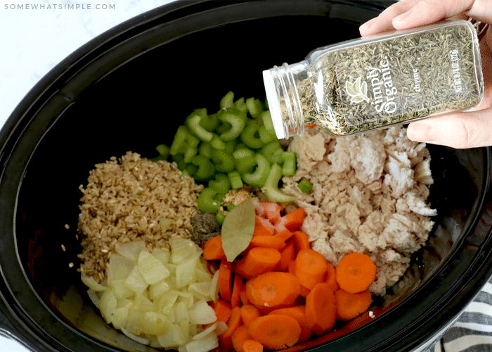 sprinkling thyme in a crockpot