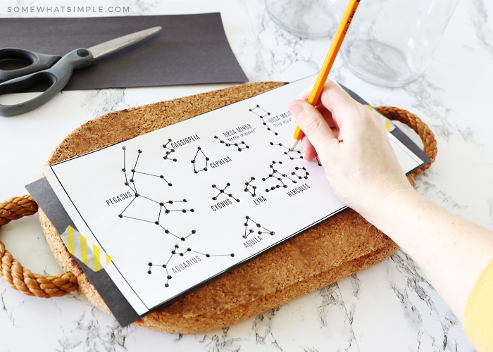 poking constellation paper with a pencil 