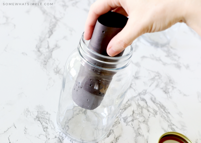 putting black paper inside a mason jar lantern