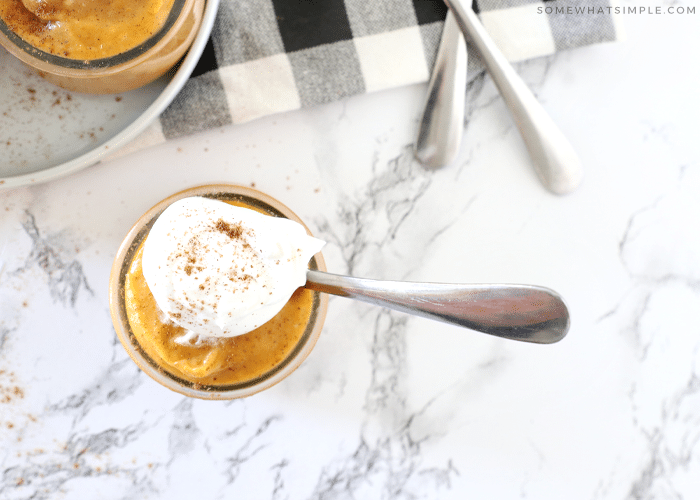 looking down at a glass full of pumpkin pudding