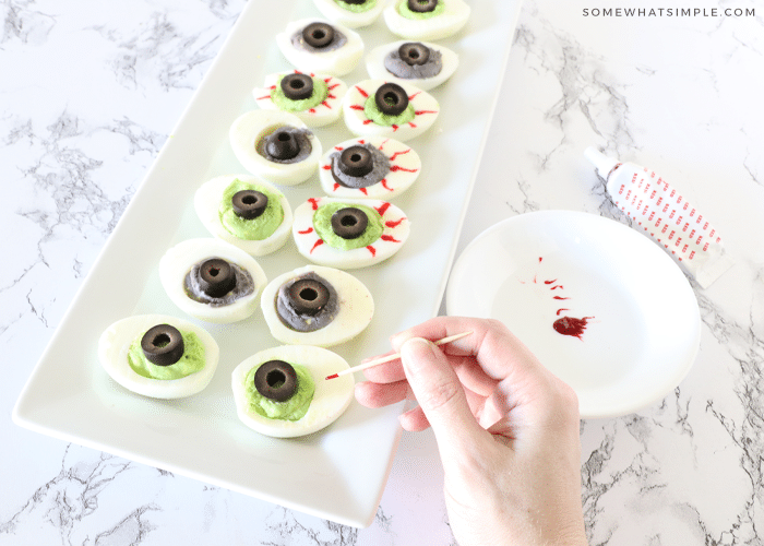 making halloween deviled eggs using food coloring