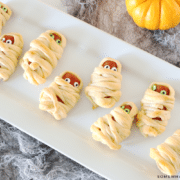mini hot dogs wrapped in strips of crescent rolls to make mummy hot dogs