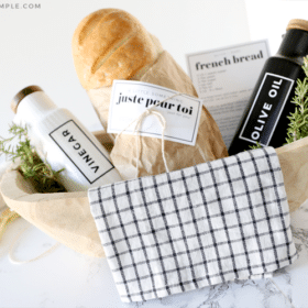 gift basket with bread, olive oil and vinegar bottles