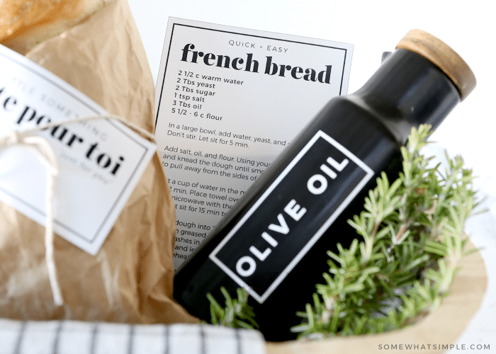 olive oil bottle in a basket with french bread