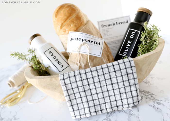 gift basket with bread, olive oil and vinegar bottles