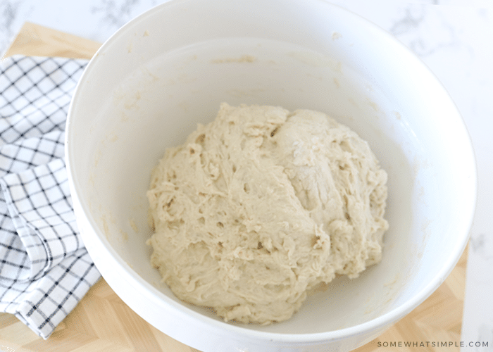 french bread dough in a white bowl