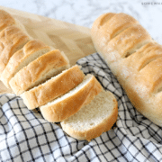 two loaves of french bread on a counter