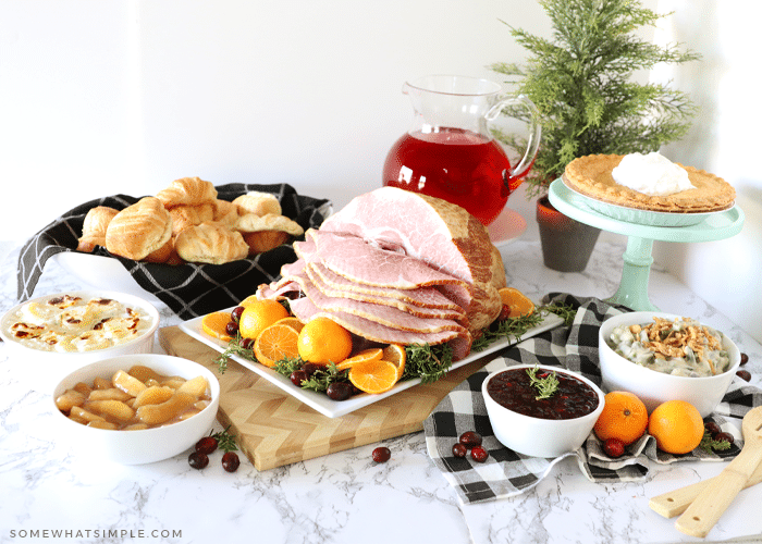 christmas dinner with ham and vegetables served on the counter