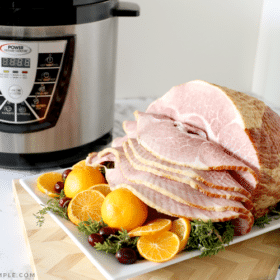 a ham that was baked in a pressure cooker on a serving tray and an instant pot in the background #christmas #pork #thanksgiving #easter #food