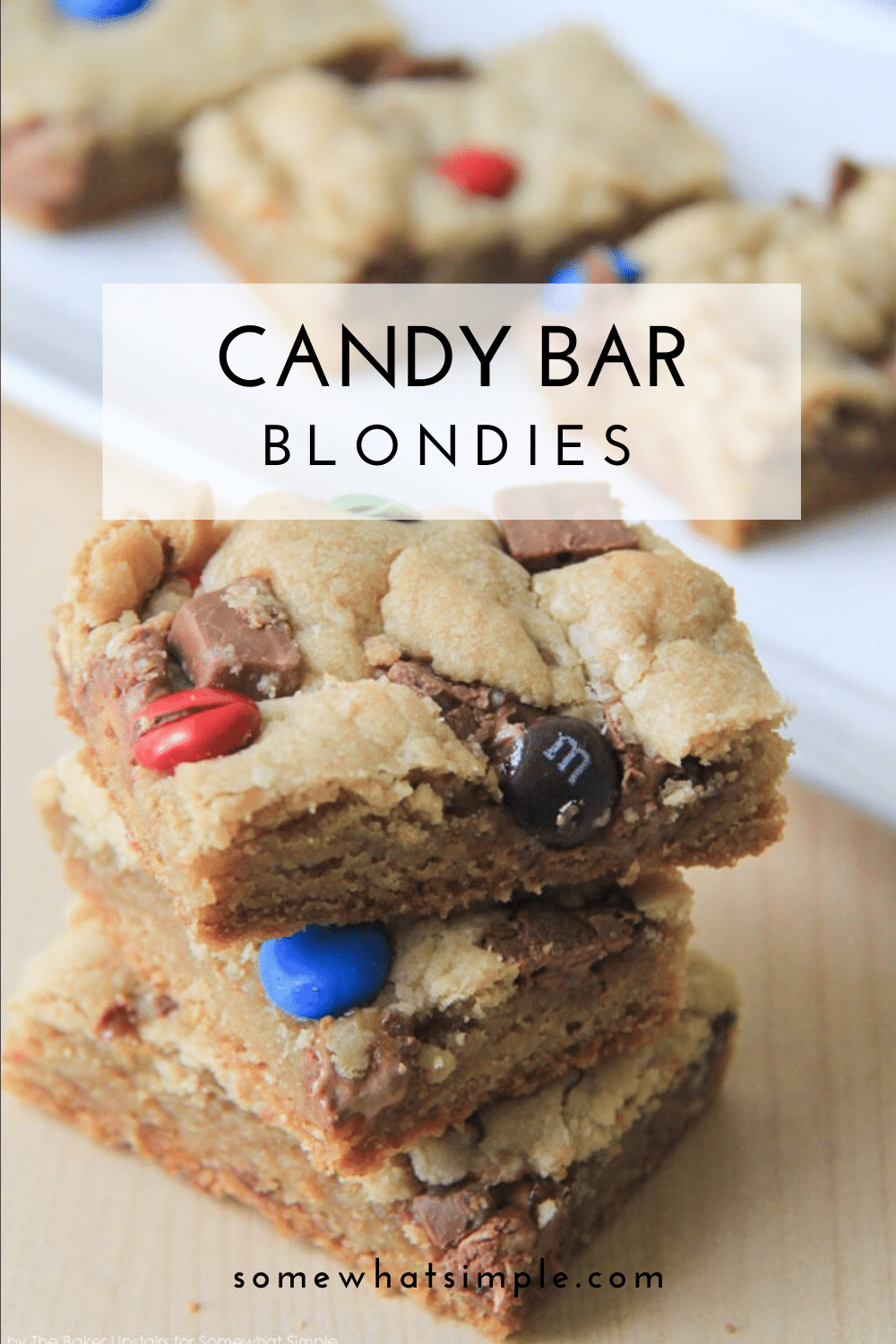 Candy Bar Blondies are a fun twist on a favorite dessert. The deliciously chewy brownie dough gets stuffed and topped with your favorite candies. It's a simple, sweet, and chocolatey treat! via @somewhatsimple