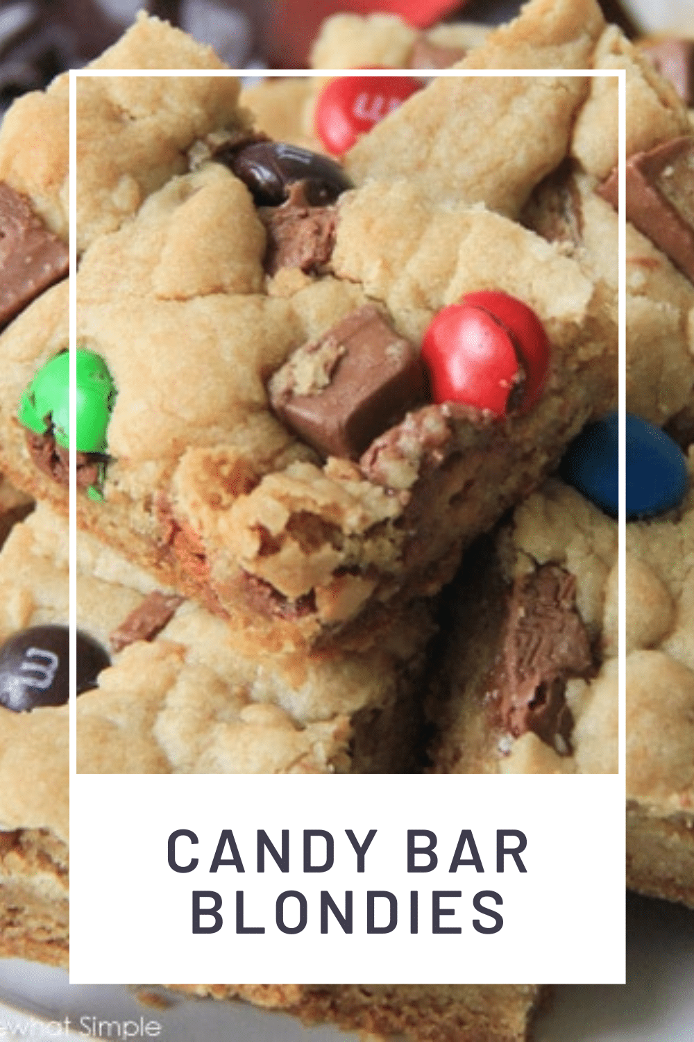 Candy Bar Blondies are a fun twist on a favorite dessert. The deliciously chewy brownie dough gets stuffed and topped with your favorite candies. It's a simple, sweet, and chocolatey treat! via @somewhatsimple