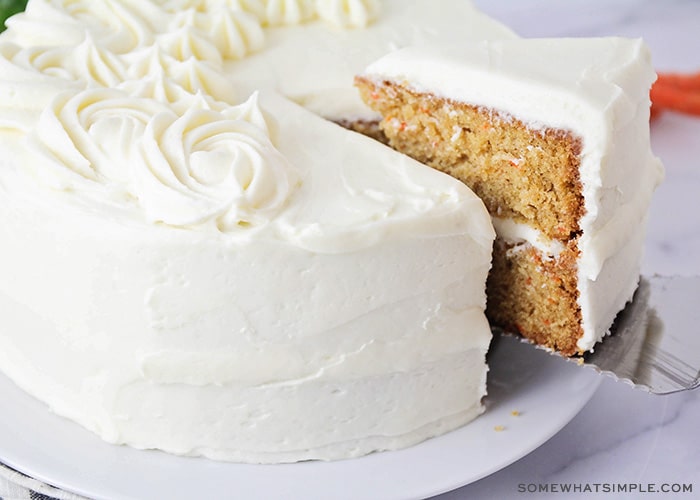 a slice cut out of a carrot cake