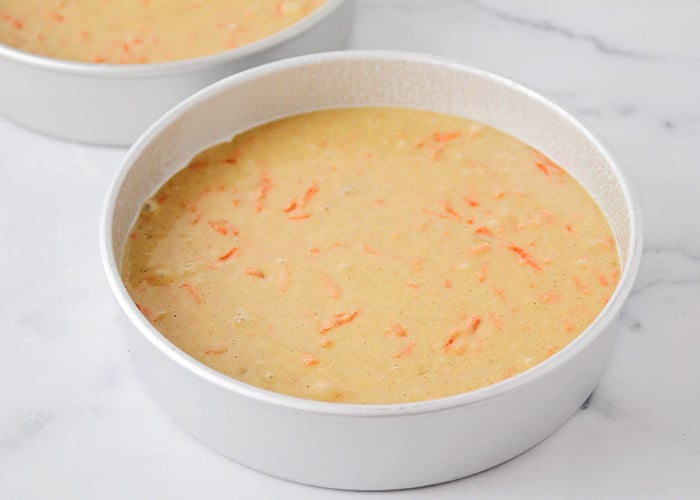 carrot cake batter in a baking pan